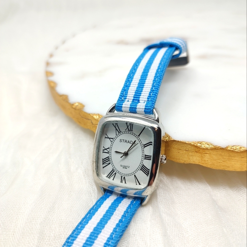 Strada blue and white striped fabric band watch silver tone frame around face